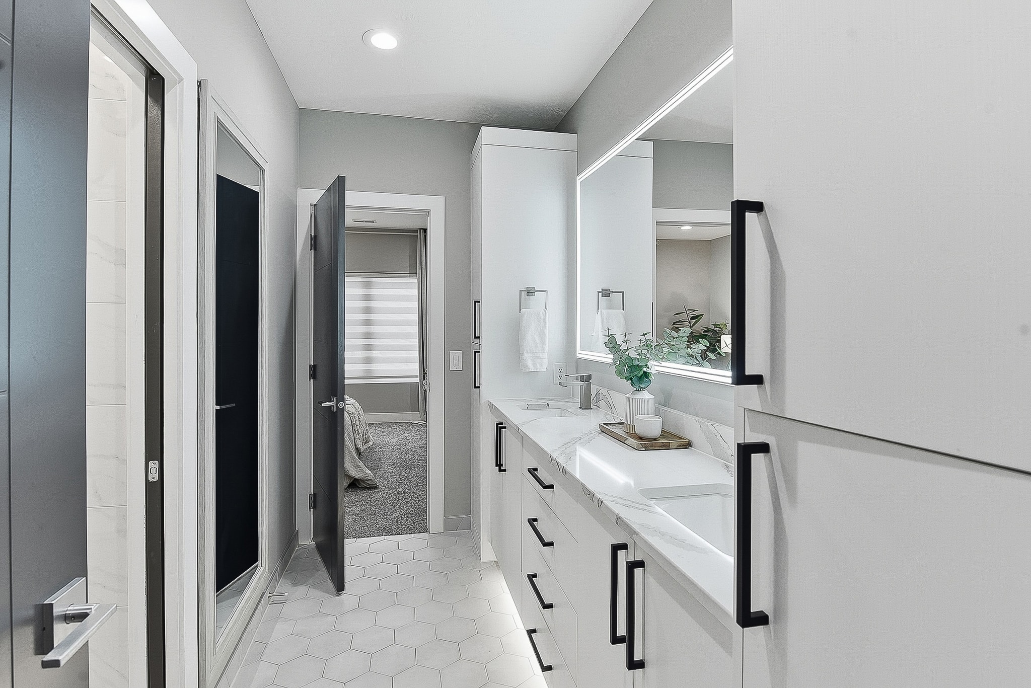 Modern bathroom with hexagon tile floor and double vanity